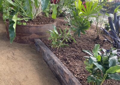 Steel ring planter and recycled railway sleepers garden edging