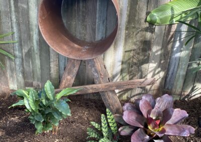 Recycled timber and steel pipe garden feature