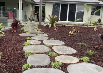 Basalt steppers pathway with pine bark mulch