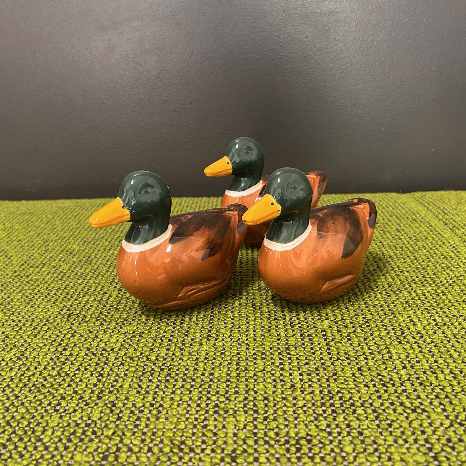 Ceramic ducks with green head